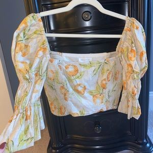 Urban Outfitters orange print crop top